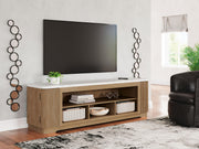 Light brown Camdill XL TV stand with fireplace option from Signature Design by Ashley, showcasing spacious storage and modern style.