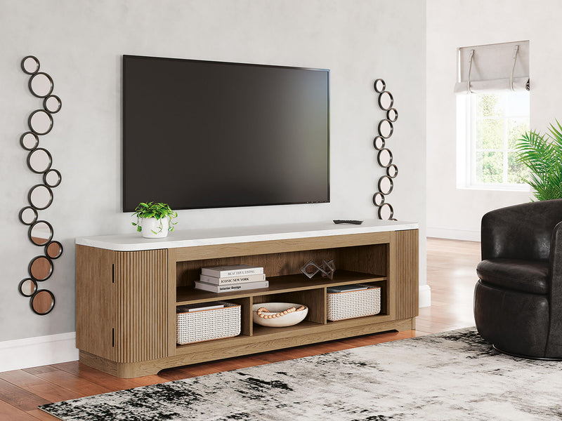 Light brown Camdill XL TV stand with fireplace option from Signature Design by Ashley, showcasing spacious storage and modern style.