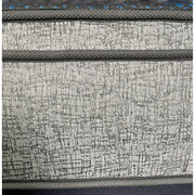 Restonic Comfort Care 12-inch hybrid Euro top twin mattress with plush comfort, gray and blue fabric, and visible pocketed coils.