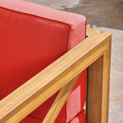 Noble House Brava mid-century modern arm chair with water-resistant cushions, featuring sleek wooden legs and plush seating.