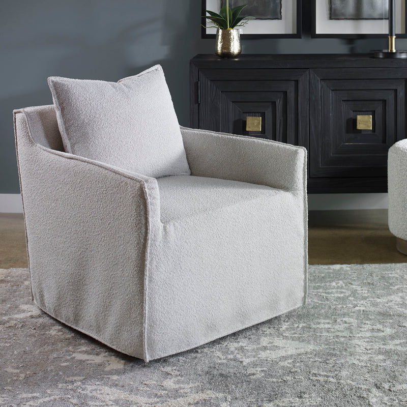 Gray Welland swivel chair by Uttermost featuring a modern design with a cushioned seat and sleek metal base.