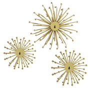 Set of three gold metal wall decor pieces by Uttermost, featuring modern geometric designs for stylish home wall accents.
