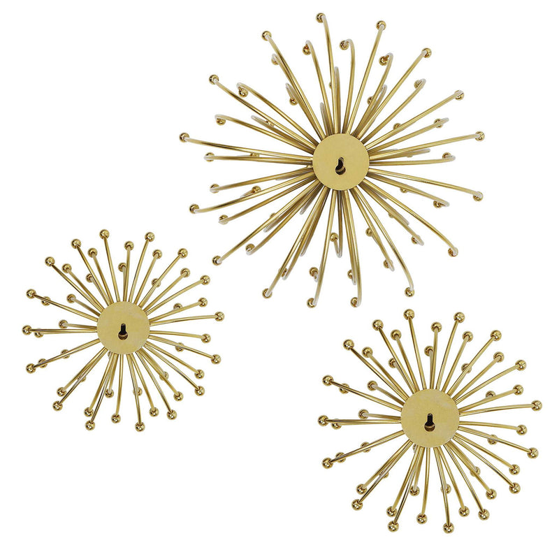 Set of three gold metal wall decor pieces by Uttermost, featuring modern geometric designs for stylish home wall accents.