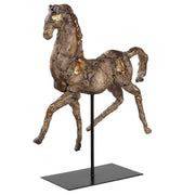 Gold horse sculpture by Uttermost featuring a detailed, elegant caballo figurine with a shiny gold finish.