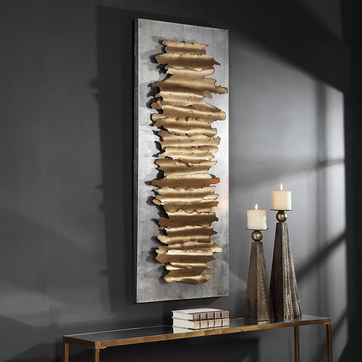 Gold metal wall decor piece by Uttermost featuring an intricate, geometric design for modern wall styling.