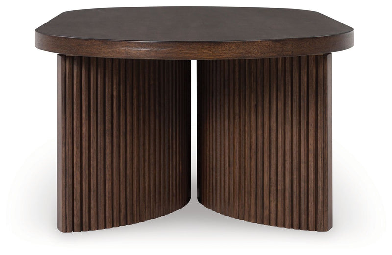 Korestone - Oval Cocktail Table - Dark Brown - R&R Furniture Gallery (Fountain Valley, CA)