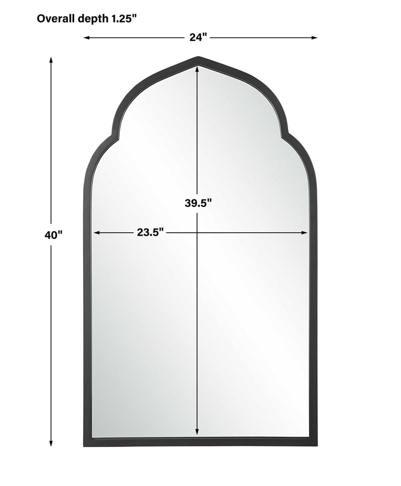 Uttermost Kenitra arched mirror with a sleek, modern frame reflecting a stylish interior.