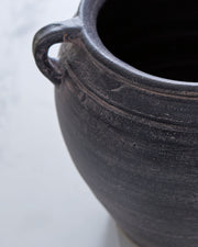 Signature Design by Ashley Meadie 9-inch vase with a sleek ceramic finish, perfect for decorative floral arrangements.