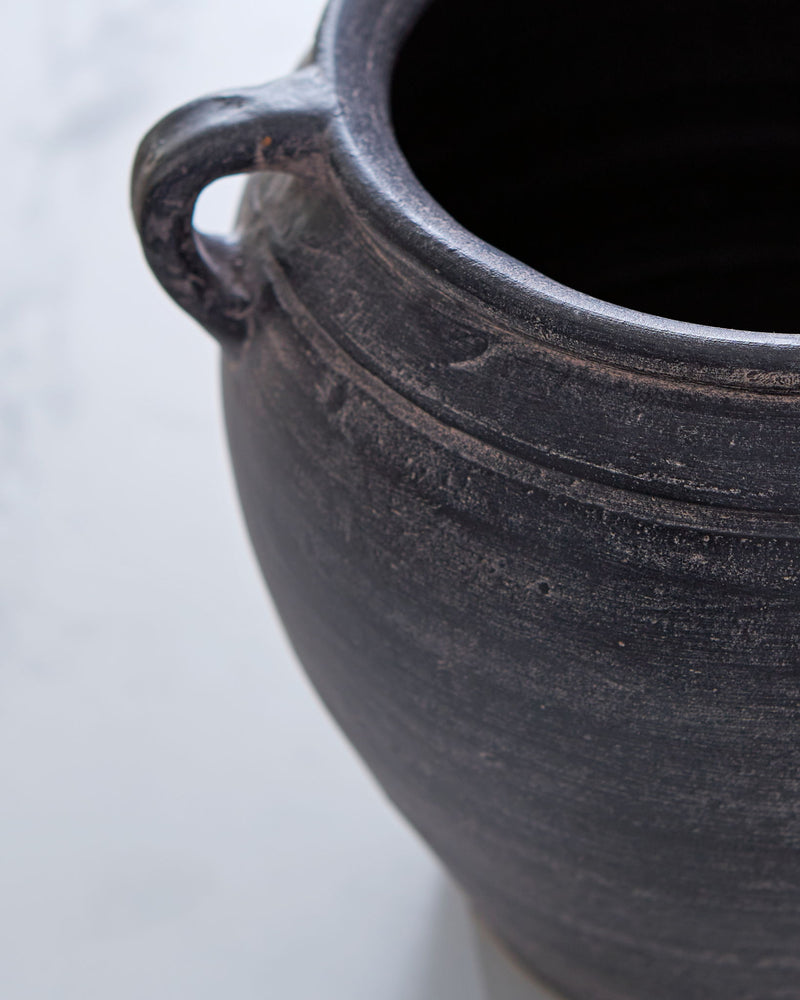 Signature Design by Ashley Meadie 9-inch vase with a sleek ceramic finish, perfect for decorative floral arrangements.