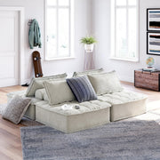 Signature Design by Ashley Bales stationary sectional sofa with plush cushions and neutral fabric, shown in a modern living room setting.