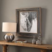 Framed black and white horse print with dark brown border by Uttermost, showcasing detailed horse artwork in a stylish display.