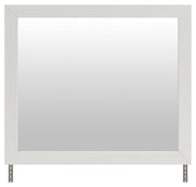 Benchcraft® bedroom mirror with a white frame, showcasing a sleek and modern design suitable for bedroom decor.