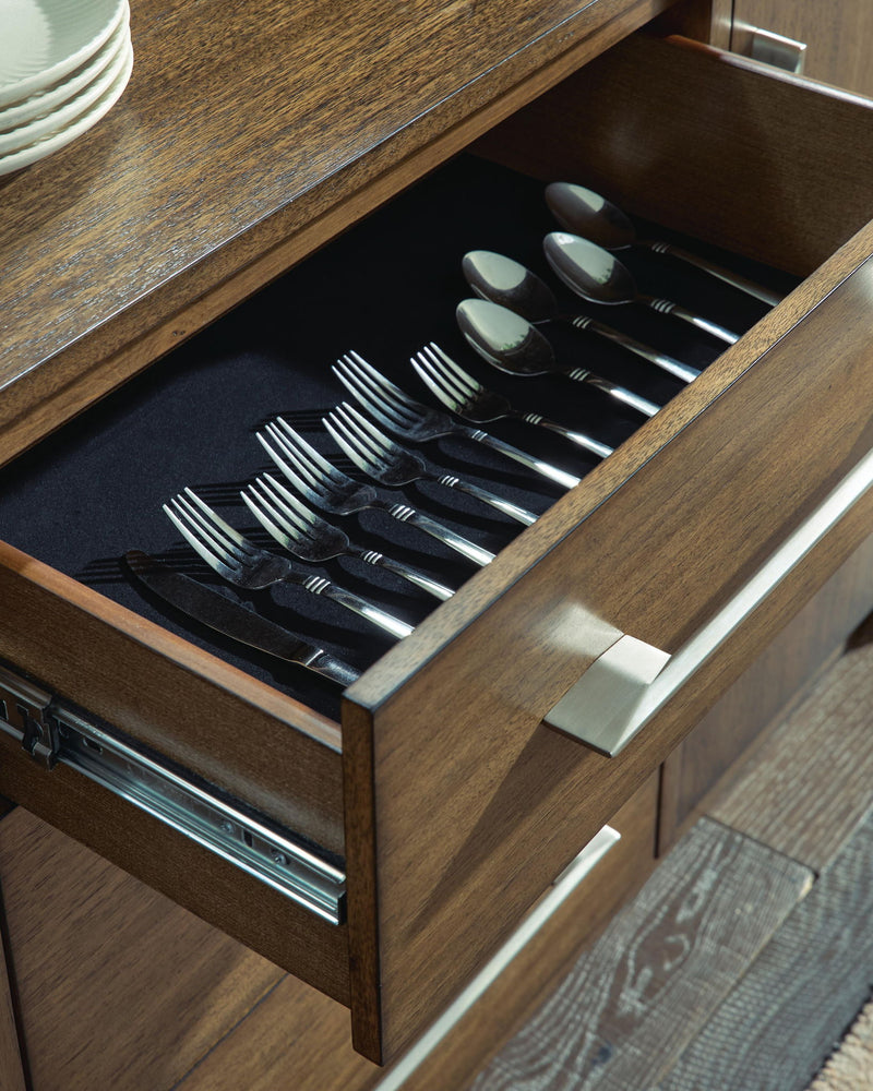 Benchcraft Marxmore brown dining room server with multiple storage compartments and a sleek, modern design.