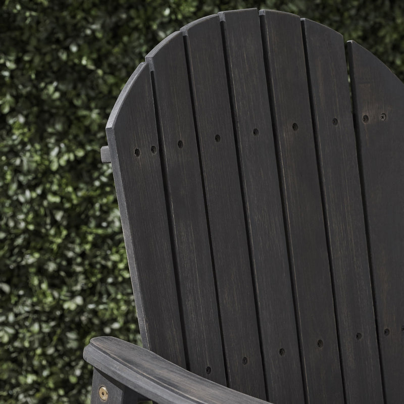 Set of two Noble House outdoor weather-resistant acacia wood Adirondack dining chairs, featuring a classic design and natural wood finish.