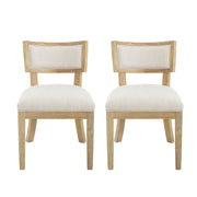 Set of two Noble House farmhouse style fabric upholstered side dining chairs with cushioned seats and wooden legs.