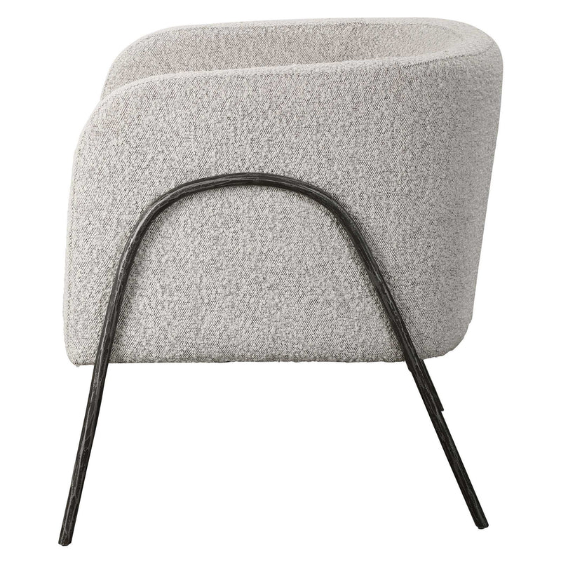 Uttermost Jacobsen accent chair with plush upholstery and wooden legs, showcasing a stylish and comfortable seating option.