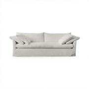 Classic Home Cassiano slip cover sofa in a neutral fabric, showcasing a stylish stationary sofa design with plush cushions.