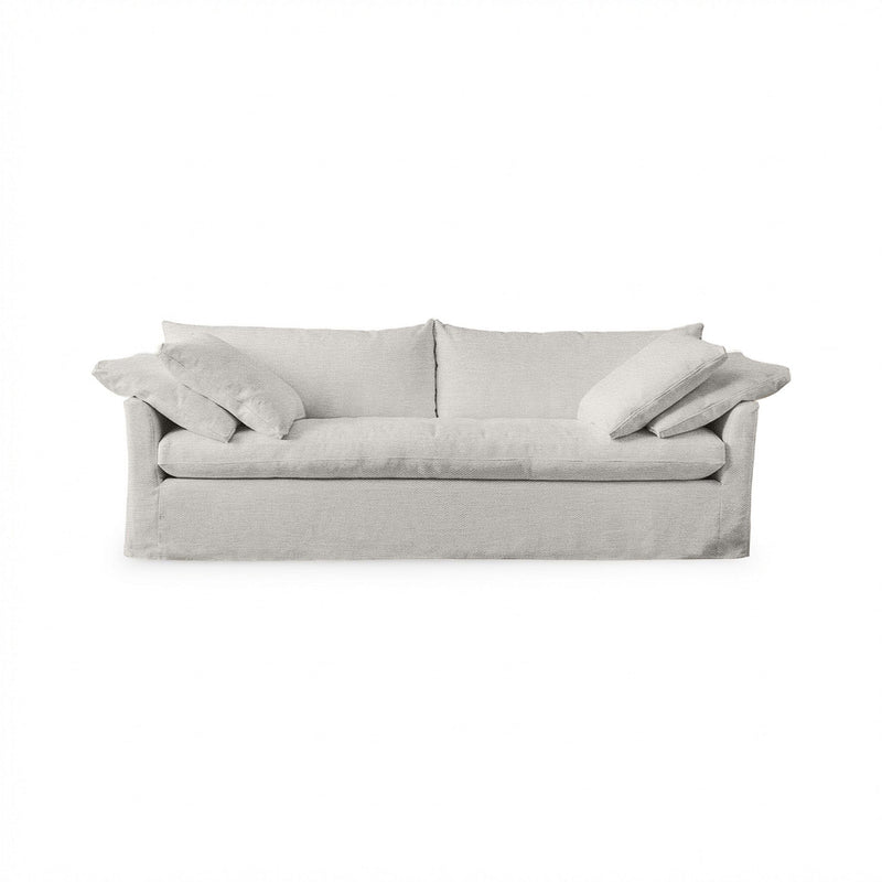Classic Home Cassiano slip cover sofa in a neutral fabric, showcasing a stylish stationary sofa design with plush cushions.