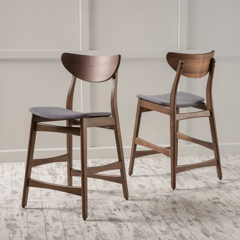 Noble House elegant counter height chair with cushioned seat and wooden legs, ideal for kitchen or bar area.