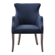 Blue Yareena Wingback Chair by Uttermost with tufted upholstery and wooden legs, showcasing elegant, comfortable seating.