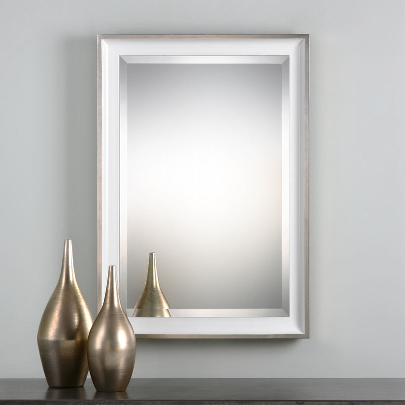 Uttermost Lahvahn white silver wall mirror with a sleek, modern rectangular frame hanging on a wall.