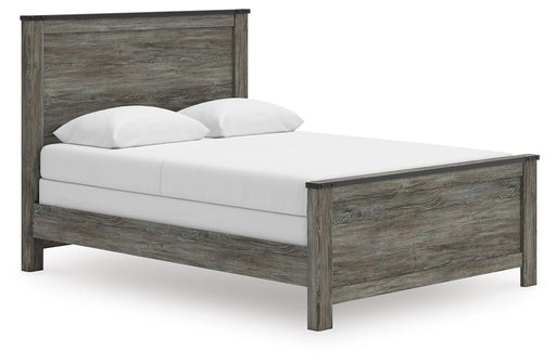 Signature Design by Ashley Frandern Panel Bed with a wooden frame and clean lines, shown in a cozy bedroom setting.