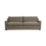 Classic Home Olivia stationary sofa with plush cushions and elegant fabric upholstery in a cozy living room setting.