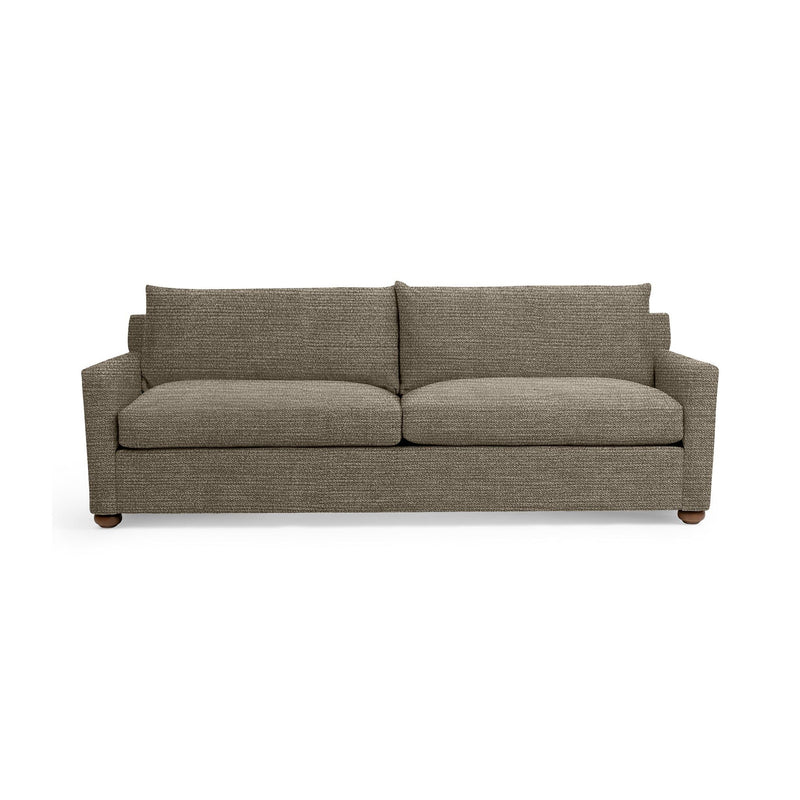Classic Home Olivia stationary sofa with plush cushions and elegant fabric upholstery in a cozy living room setting.