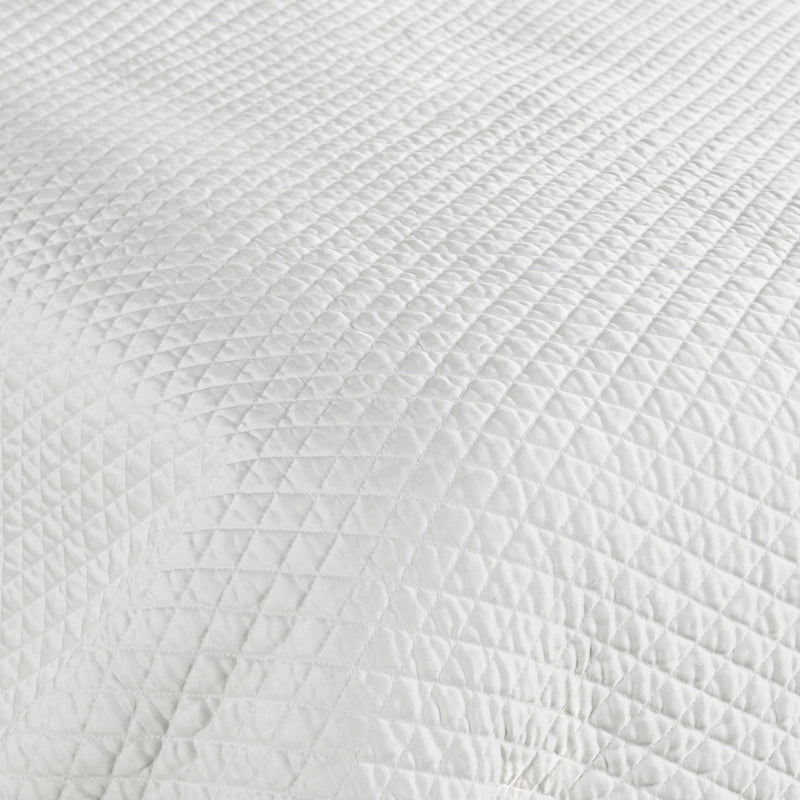 Classic Home diamond quilt with matching shams, featuring a textured pattern in soft, cozy fabric for a stylish bedroom look.