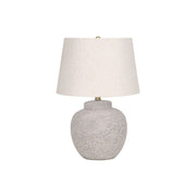 Modern cream concrete table lamp by 8th Street with a sleek, minimalist design and a cylindrical shape.