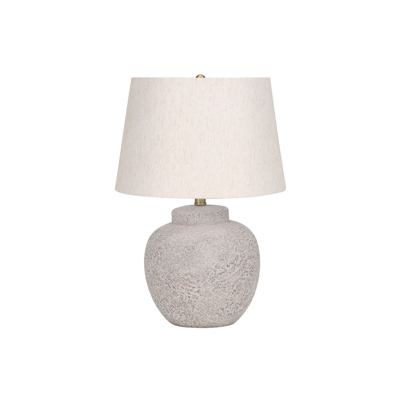 Modern cream concrete table lamp by 8th Street with a sleek, minimalist design and a cylindrical shape.