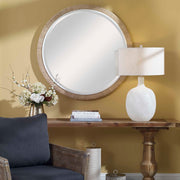 Light brown round rope wall mirror by Uttermost with a natural woven frame, ideal for modern or coastal decor.