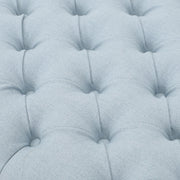 Noble House Guernsey storage ottoman with tufted top, showcasing its elegant upholstered design and functional interior storage space.