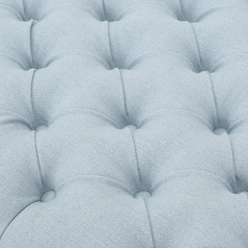Noble House Guernsey storage ottoman with tufted top, showcasing its elegant upholstered design and functional interior storage space.