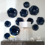 Set of three ceramic wall decor pieces by Uttermost featuring modern abstract designs for stylish wall decoration.
