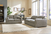 Benchcraft® Dramatic living room set featuring a stationary chair and matching ottoman in a stylish fabric.