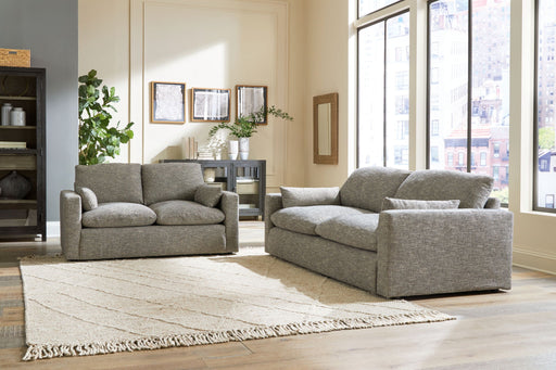 Benchcraft® Dramatic living room set featuring a stationary chair and matching ottoman in a stylish fabric.