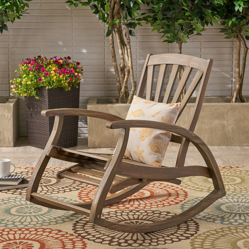 Gray outdoor reclining rocking chair by Noble House with cushioned seat and backrest, ideal for patio or garden relaxation.