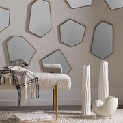 Set of four gold modern wall mirrors by Uttermost, featuring sleek frames and contemporary design for stylish wall decor.