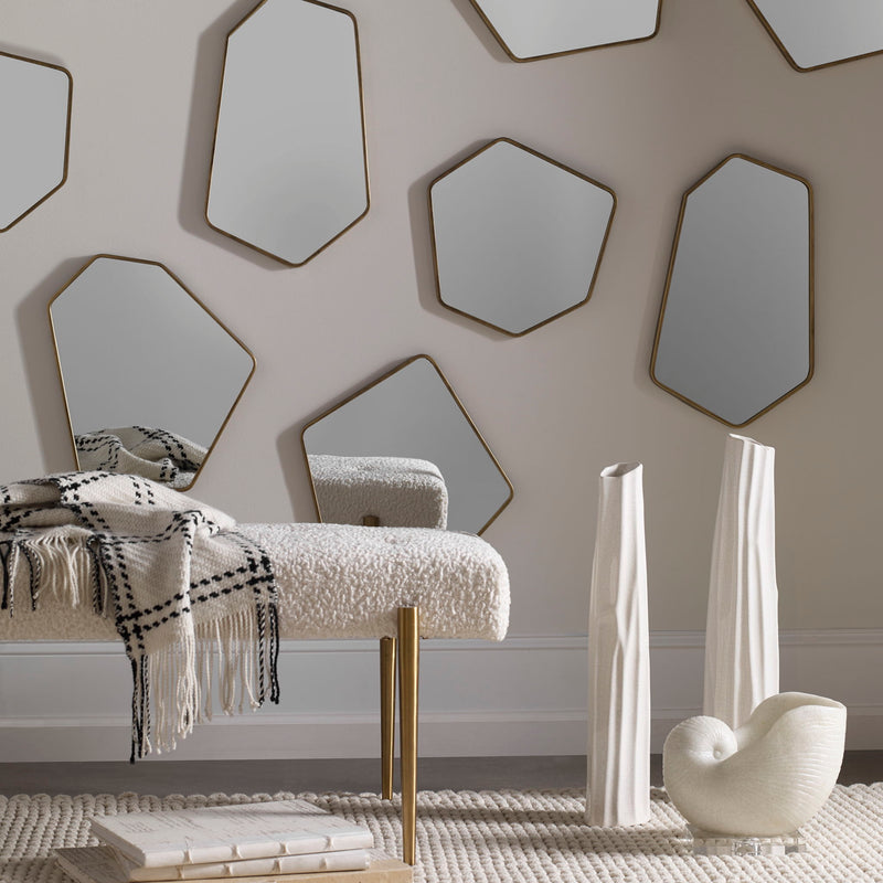 Set of four gold modern wall mirrors by Uttermost, featuring sleek frames and contemporary design for stylish wall decor.
