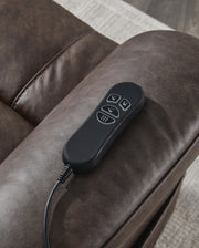 Signature Design by Ashley Oatman Power Lift Recliner in beige fabric, showing a plush, padded lift chair with armrests and reclining feature.