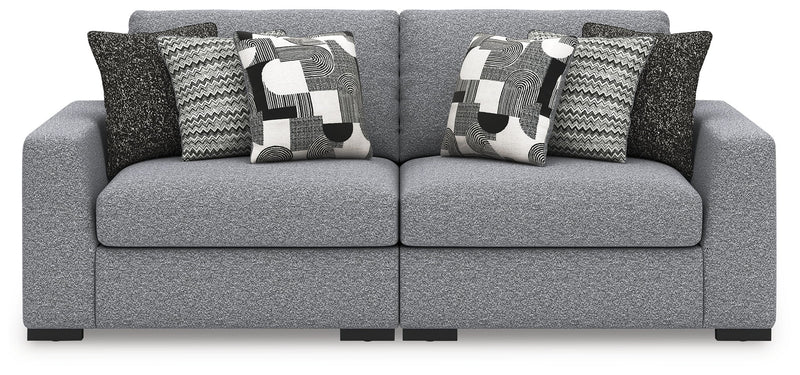 Benchcraft® Bealton stationary sectional sofa with plush cushions and fabric upholstery in a cozy living room setting.