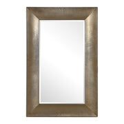 Large champagne wall mirror from the Valenton series by Uttermost, with a sleek rectangular frame and reflective glass surface.