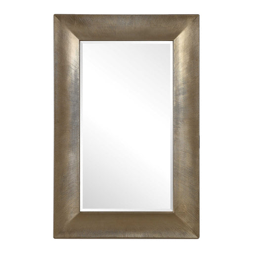 Large champagne wall mirror from the Valenton series by Uttermost, with a sleek rectangular frame and reflective glass surface.