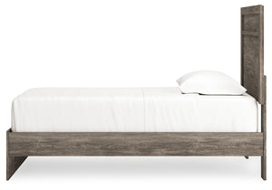 Signature Design by Ashley Ralinksi panel bed with a sleek wooden frame and modern design, shown in a cozy bedroom setting.