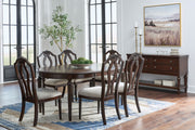 Signature Design by Ashley Lavinton 8-piece dining set with extension table, six side chairs, and server in brown.