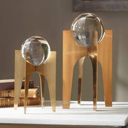 Uttermost Ellianna crystal spheres table accessory set with two clear glass spheres on a wooden surface.