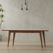 Rectangular dining table by Simpli-Home with a wooden finish, perfect for family meals and modern dining rooms.