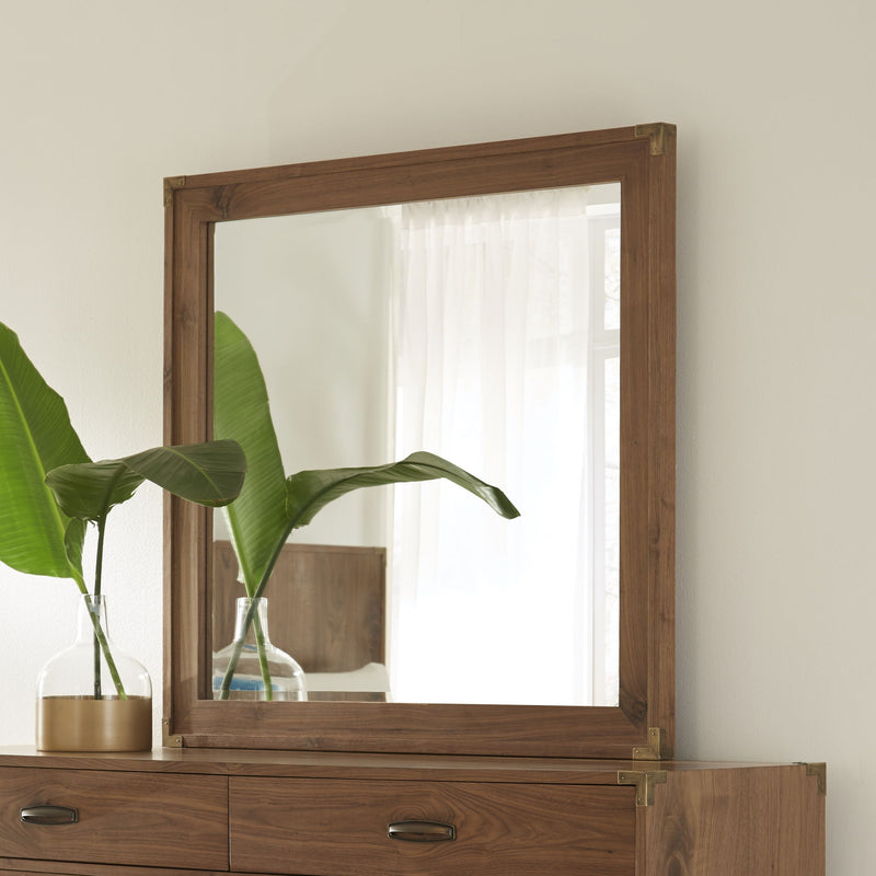 Modus Adler beveled glass mirror in natural walnut frame, standalone design reflecting light and showcasing elegant craftsmanship.