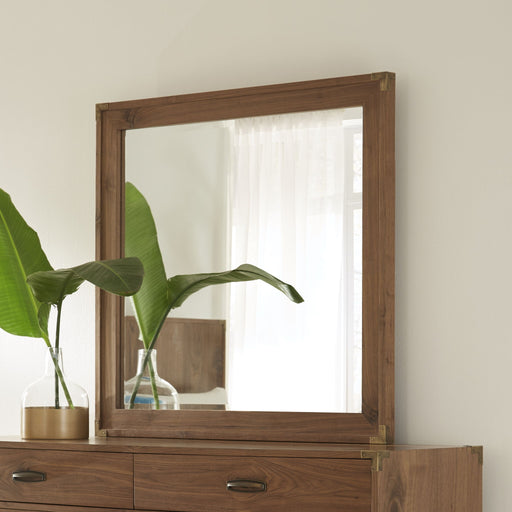 Modus Adler beveled glass mirror in natural walnut frame, standalone design reflecting light and showcasing elegant craftsmanship.